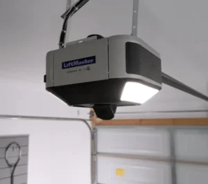 A LiftMaster garage door opener powered by MyQ affixed to a garage ceiling