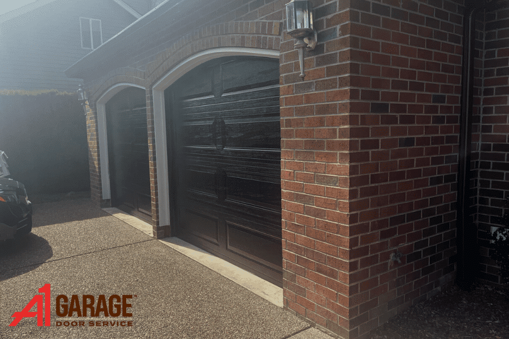 Black Garage Door on Brick House